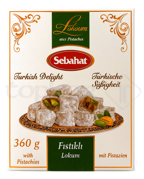 Sebahat Lokum mit Pistazien auf orientalischem Teller mit Puderzucker und ganzen Pistazien dekoriert