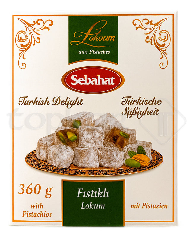 Sebahat Lokum mit Pistazien auf orientalischem Teller mit Puderzucker und ganzen Pistazien dekoriert