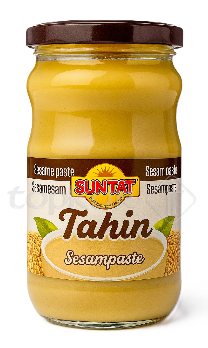 Suntat Sesampaste Tahin im Glas mit braunem Deckel vor weißem Hintergrund